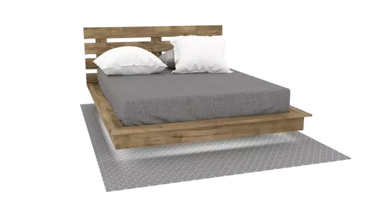 A completed wooden DIY floating platform bed with a headboard, mattress, and pillows, showcasing a modern levitation effect